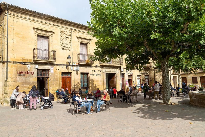 People sitting outside a cafe in Plaza Mayor, village of San Vicente de la Sonsierra, La Rioja, Spain, Europe