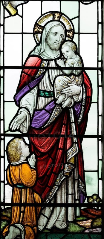 Stained glass windows in All Saints church, Lydiard Millicent, Wiltshire, England, UK