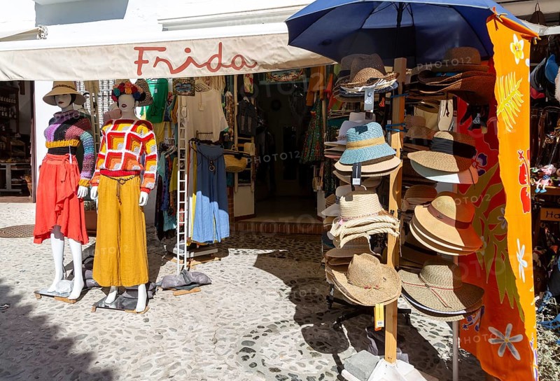 Souvenir shop with clothing and hats on display, Frigiliana, Axarquia, Andalusia, Spain, Europe