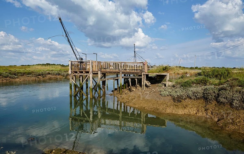 Canal and crane for oyster farming in Saint-Pierre-d'Oleron, Departement Charente-Maritime, Nouvelle-Aquitaine, France, Europe