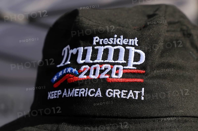 Convinced Trump supporter in Germany wears a cap with the campaign slogan Trump 2020 - keep America great