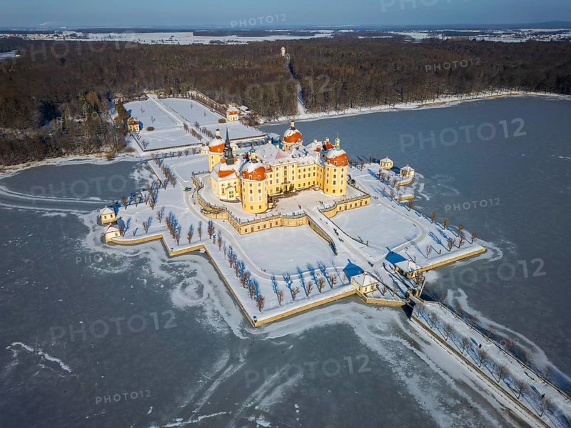 Moritzburg Castle on the castle island surrounded by the frozen castle pond, Moritzburg, Saxony, Germany, Europe