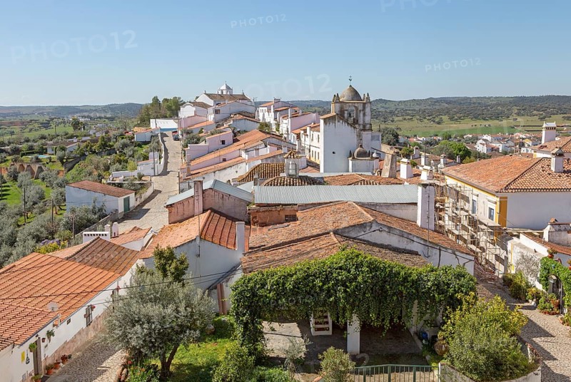 View over rooftops of whitewashed houses and streets in the small rural settlement village of Terena, Alentejo Central, Portugal, Southern Europe, Europe
