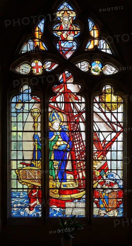 Stained glass window of Saint Nicholas standing in ship by Martin Travers 1927 Cricklade church, Wiltshire, England, UK