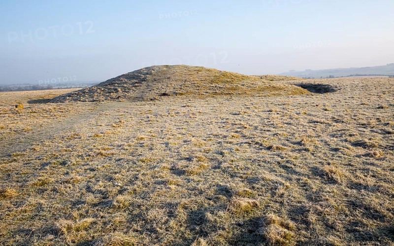 Bronze Age bowl barrow on Windmill Hill, a Neolithic causewayed enclosure, near Avebury, Wiltshire, England, UK