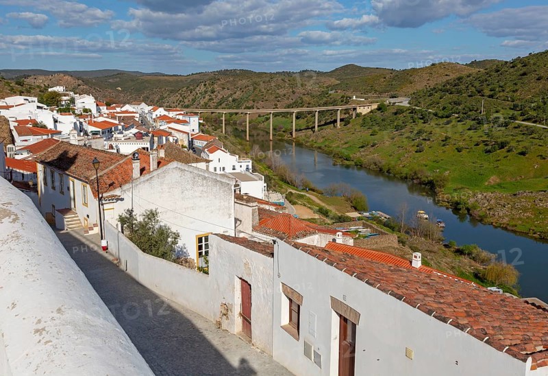 Landscape view of valley of river Rio Guadiana over rooftops in the medieval village of Mertola, Baixo Alentejo, Portugal, Southern Europe, Europe
