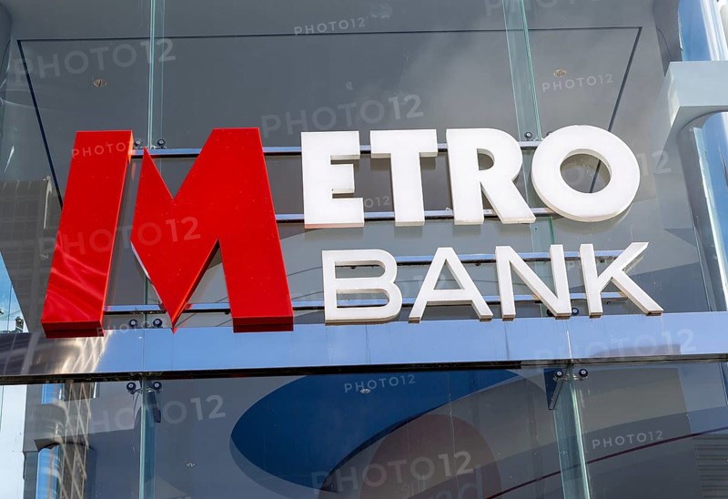 Signs on Metro Bank building, Regent Street, Swindon, Wiltshire, England, UK