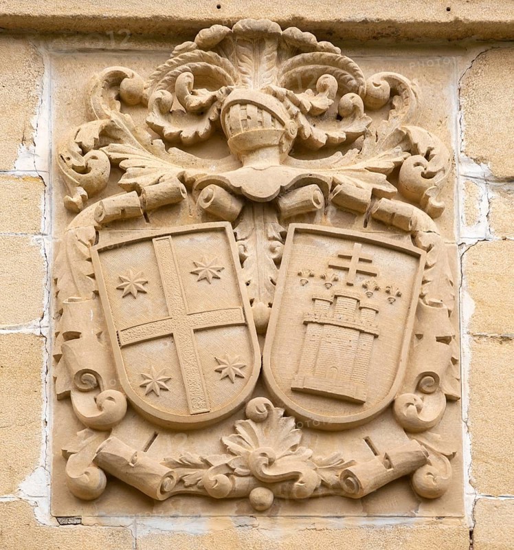 Stonework detail of coat of arms on wall of building, village of Elceigo, Alava, Basque Country, northern Spain