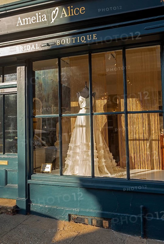 Wedding dress in shop window Amelia and Alci bridal boutique shop, Market Hill, Woodbridge, Suffolk, England, UK