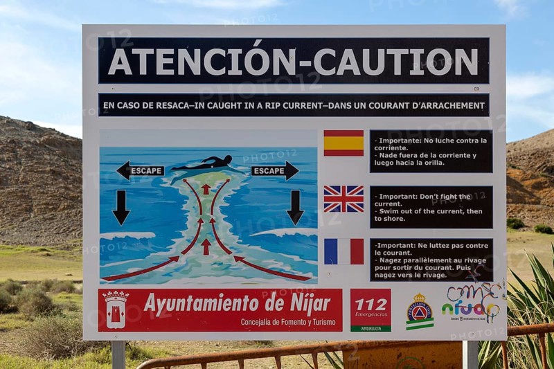 Beach sign caution auto swimmers about danger of rip current, Cabo de Gata natural park, Almeria, Spain, Europe