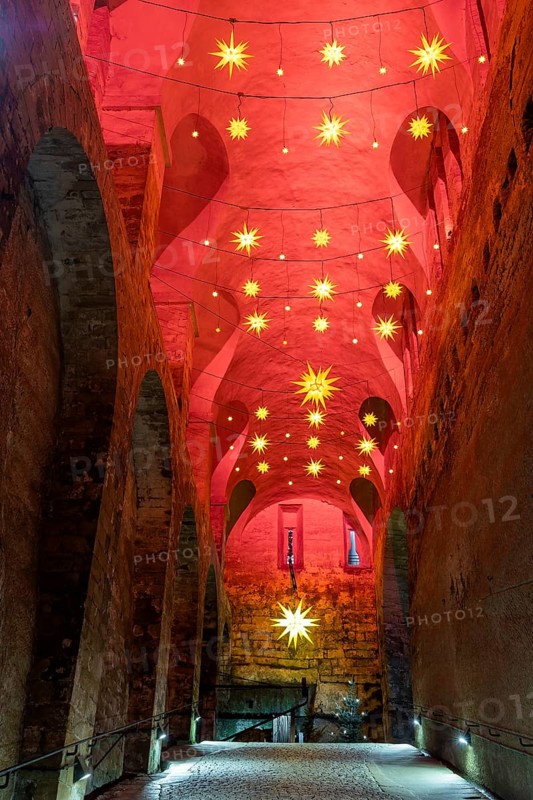 Winter atmosphere at the mountain fortress. Dark appareille with Advent stars, Koenigstein, Saxony, Germany, Europe