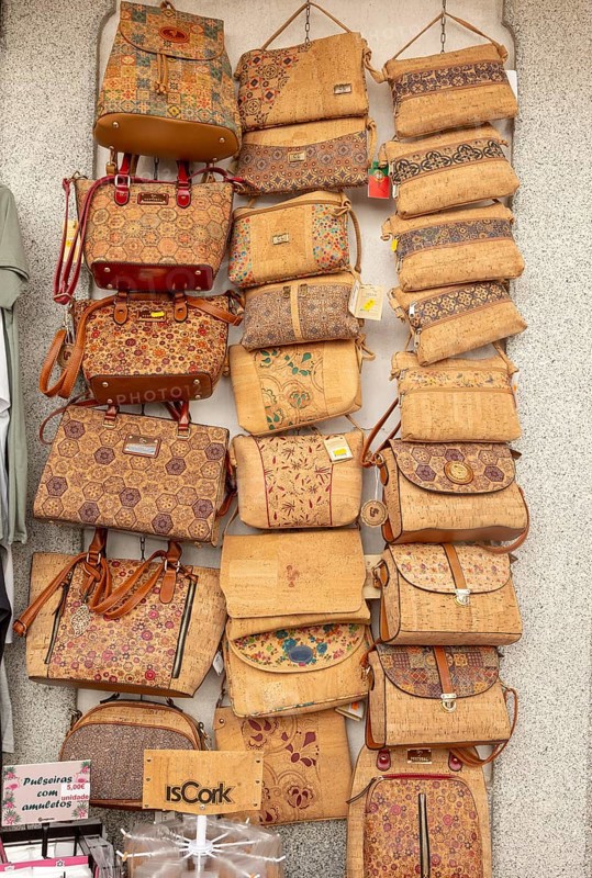 Close up of shop display of handbags made from cork oak souvenir products of butterflies and fish on sale, city of Evora, Alto Alentejo, Portugal, southern Europe, Europe