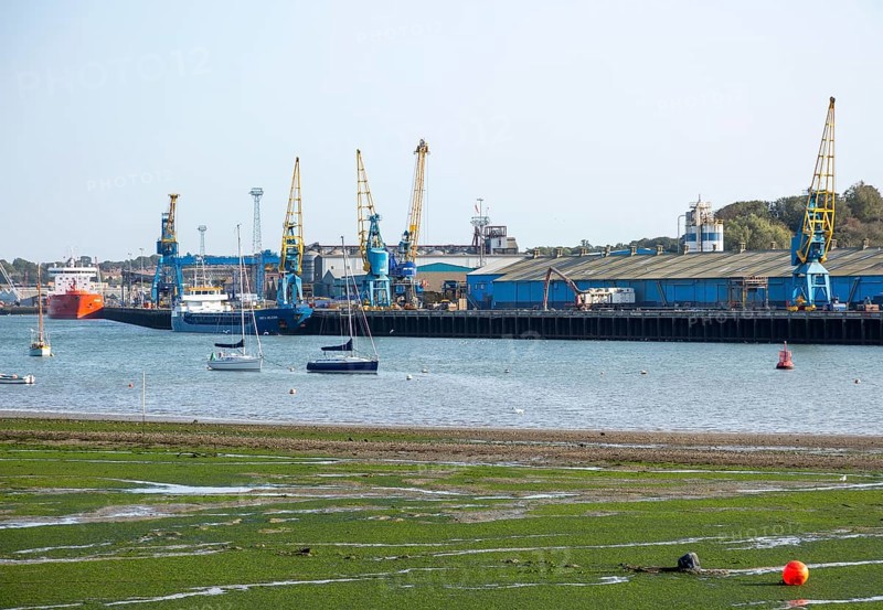 Cranes warehouses ships quayside at Cliff Quay, Port of Ipswich, Suffolk, England, UK tidal River Orwell