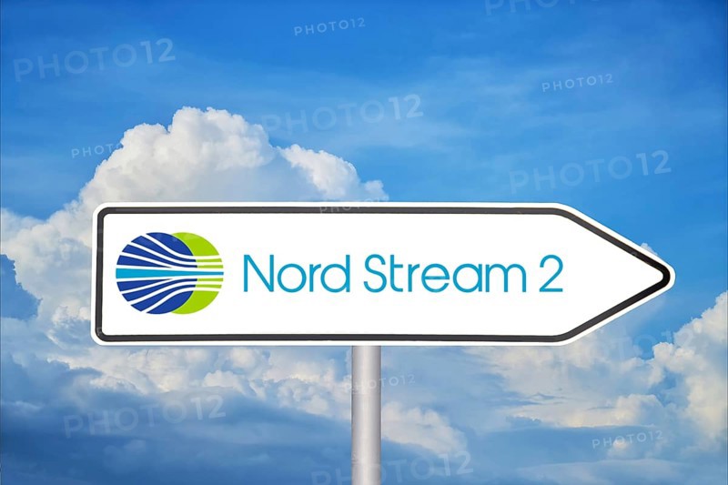 Symbolic image Nord Stream 2: Traffic sign with logo in front of blue sky (Composing)