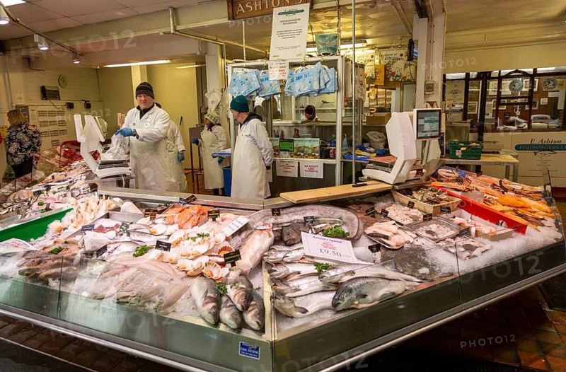 Ashton's fishmonger stall inside the market in city centre of Cardiff, South Wales, UK