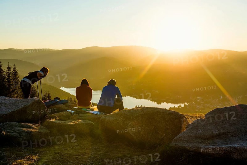 Hiking group, view from Hochfirst to Titisee and Feldberg, sunset, near Neustadt, Black Forest, Baden-Wuerttemberg, Germany, Europe