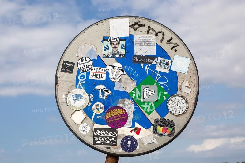 Surfer stickers on road sign at coast Odeceixe, Algarve, Portugal, Southern Europe, Europe