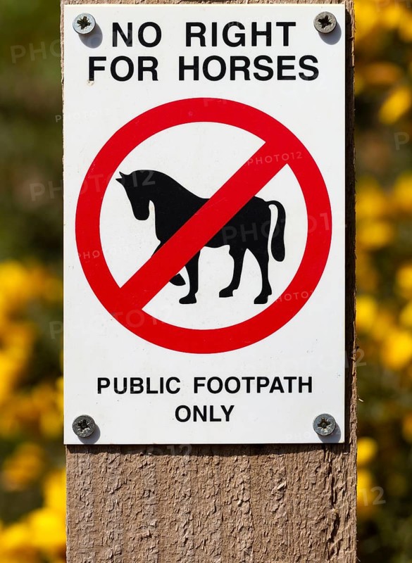 Macro close up No Right For Horses Public Footpath Only sign on fencepost, Sutton, Suffolk, England, UK
