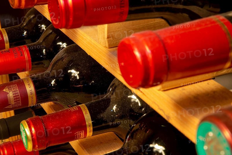 Wine cellar with red wine bottles (editorial)