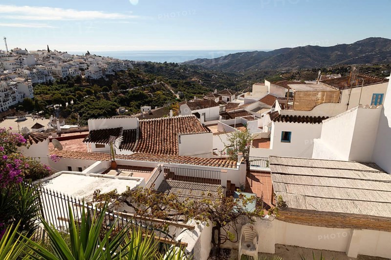 Rooftops of traditional pueblo blanco whitewashed houses in village of Frigiliana, Axarquia, Andalusia, Spain, Europe