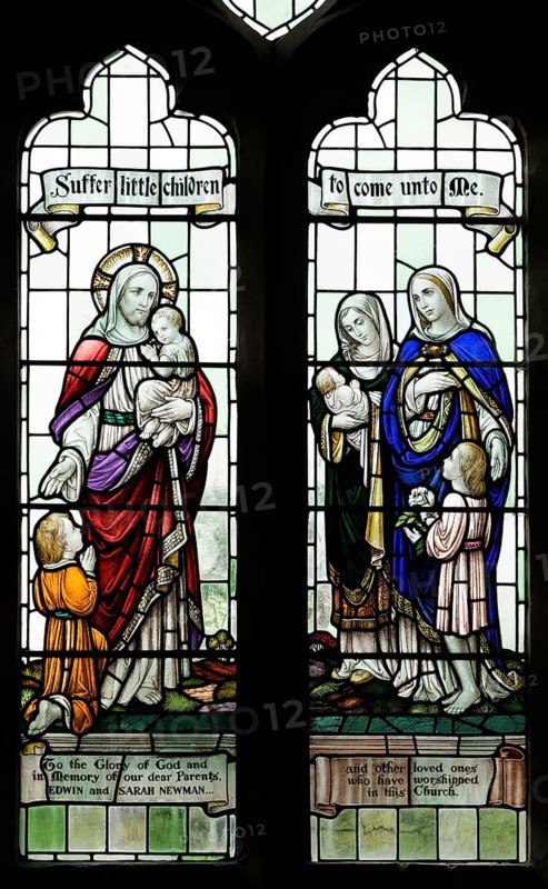 Stained glass windows in All Saints church, Lydiard Millicent, Wiltshire, England, UK