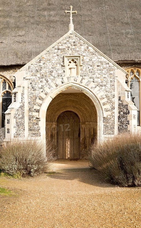 Entrance porch doorway village parish church and churchyard, Saint Mary, Henstead, Suffolk, England, UK