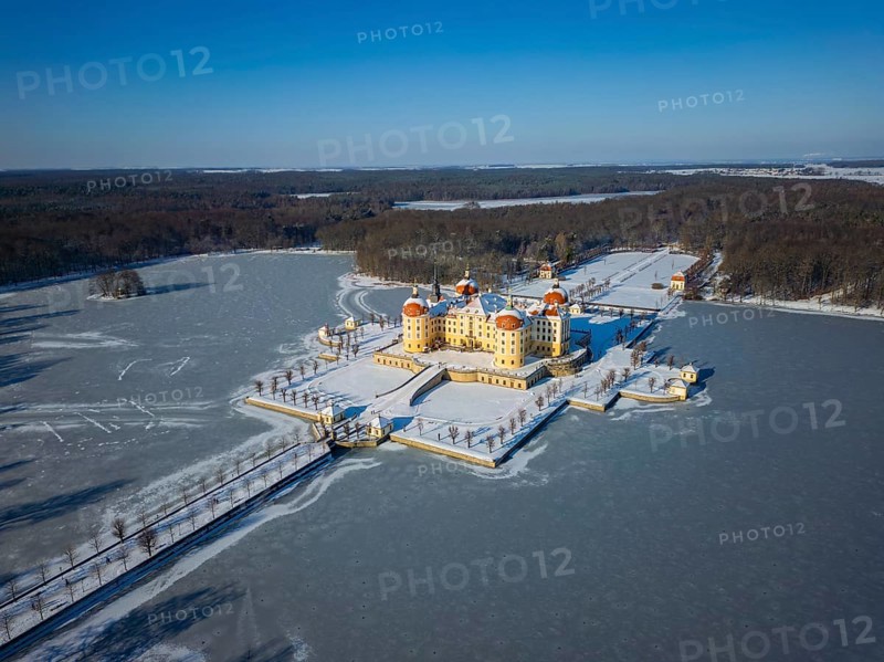 Moritzburg Castle on the castle island surrounded by the frozen castle pond, Moritzburg, Saxony, Germany, Europe