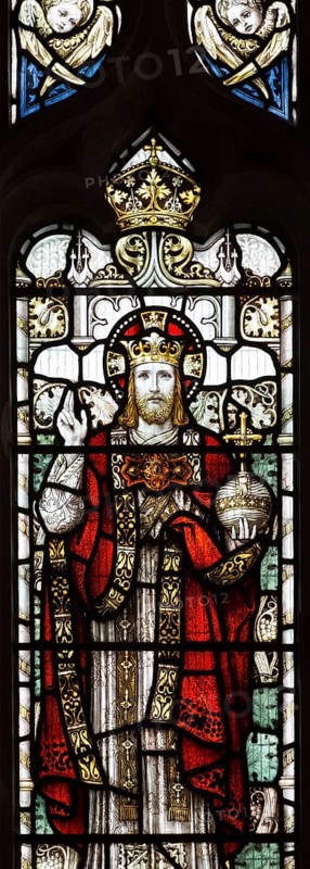 Stained glass window of Jesus Christ in his majesty wearing a crown, church of Saint Mary, Friston, Suffolk, England, UK