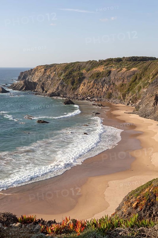 Secluded sandy beach in bay between rocky headlands at Parque Natural do Sudoeste Alentejano e Costa Vicentina, Natural Park, landscape view on the Ruta Vicentina long distance walking trail, at Praia dos Machados, Carvalhal, Alentejo Littoral, Portugal, southern Europe, Europe