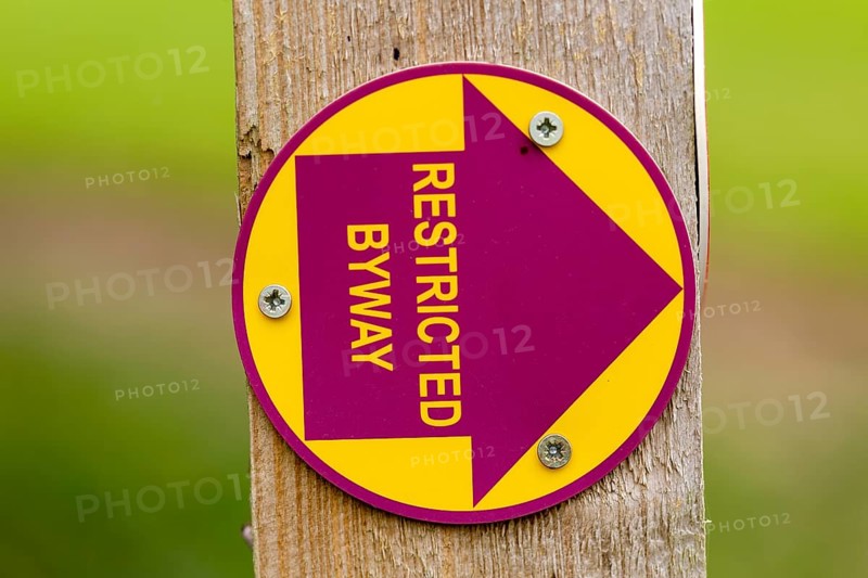 Macro close up of Restricted Byway sign on fencepost, Sutton, Suffolk, UK