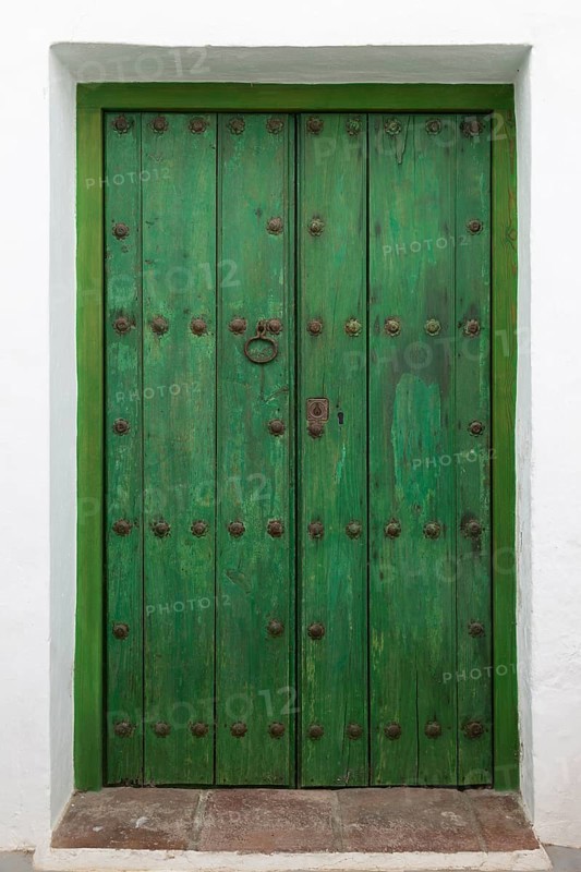 Faded green paint traditional wooden house door, Frigiliana, Axarquia, Andalusia, Spain, Europe