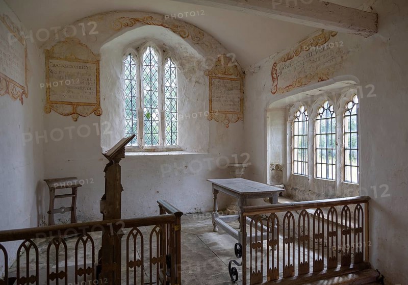 Chancel All Saints church, Leigh, Wiltshire, England, UK interior with ancient wall texts old wooden furniture