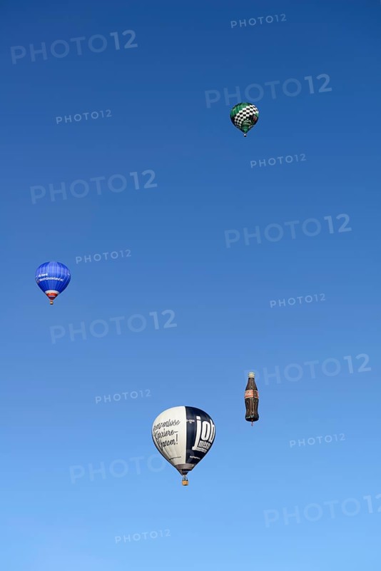 Four hot air balloons in the blue sky, Montgolfiade Tegernseer Tal, Balloon Week Tegernsee, Warngau, Bavarian Oberland, Upper Bavaria, Bavaria, Germany, Europe