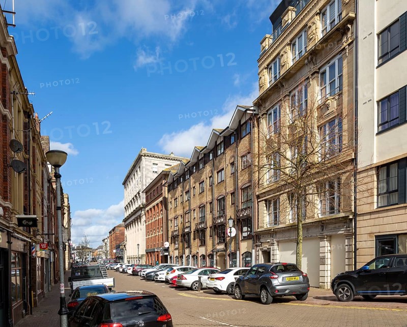 Large nineteenth century buildings being convert to apartments and offices, Butetown, Cardiff Bay, South Wales, UK