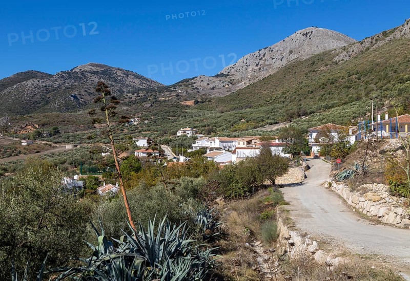 Small village of Aldea de Guaro, Periana, Axarquia, Andalusia, Spain at base of limestone mountains