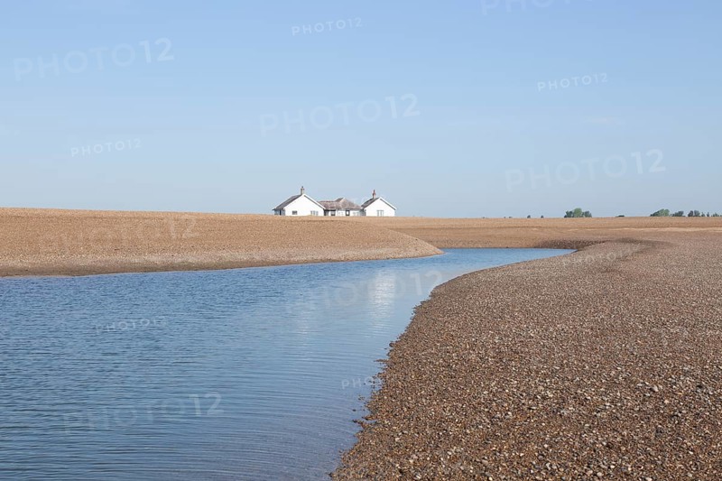 Bungalow house 'The Beacons' at risk of coastal erosion, close to the sea, Shingle Street, Suffolk, England, UK