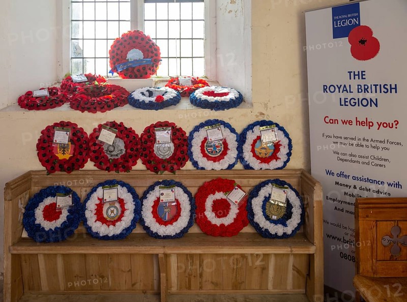 Village parish church Shotley, Suffolk, England, UK Royal British Legion remembrance poppy wreaths