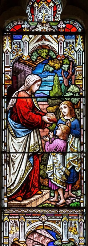 Stained glass west window detail Acts of Mercy, 1878, Great Bealings church, Suffolk, England, UK by H Hughes