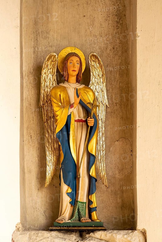 Interior historic village parish church, Wingfield, Suffolk, England, UK statue Angel Gabriel