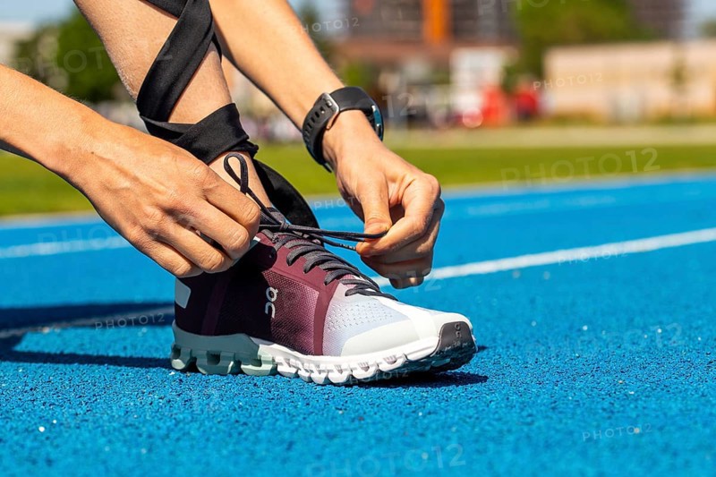 Young sportswoman wears running shoes from the Swiss shoe brand ON