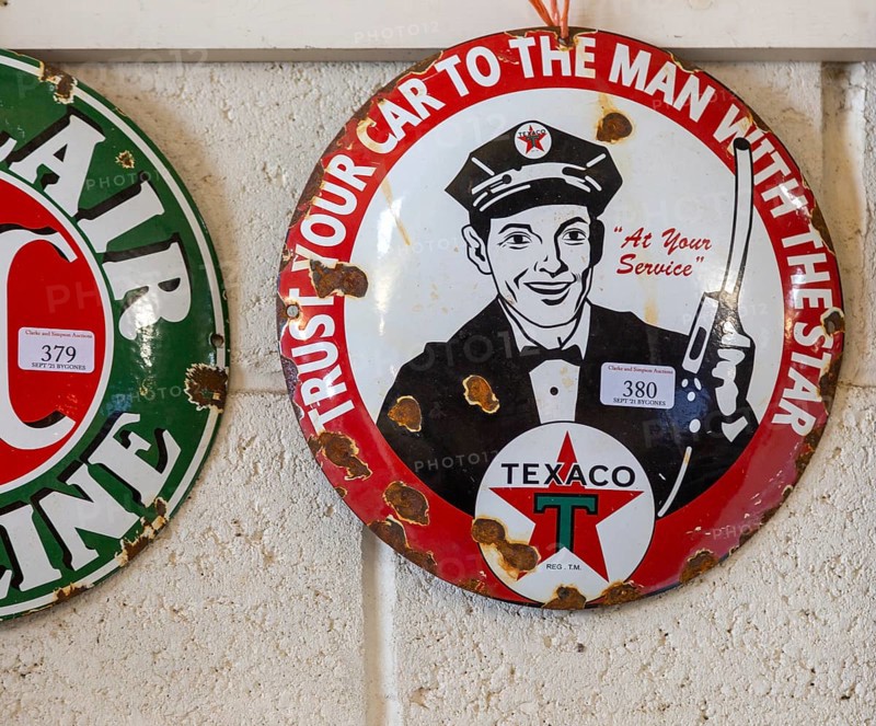 Vintage Texaco oil petrol metal advertising sign on display at auction