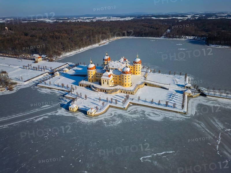Moritzburg Castle on the castle island surrounded by the frozen castle pond, Moritzburg, Saxony, Germany, Europe
