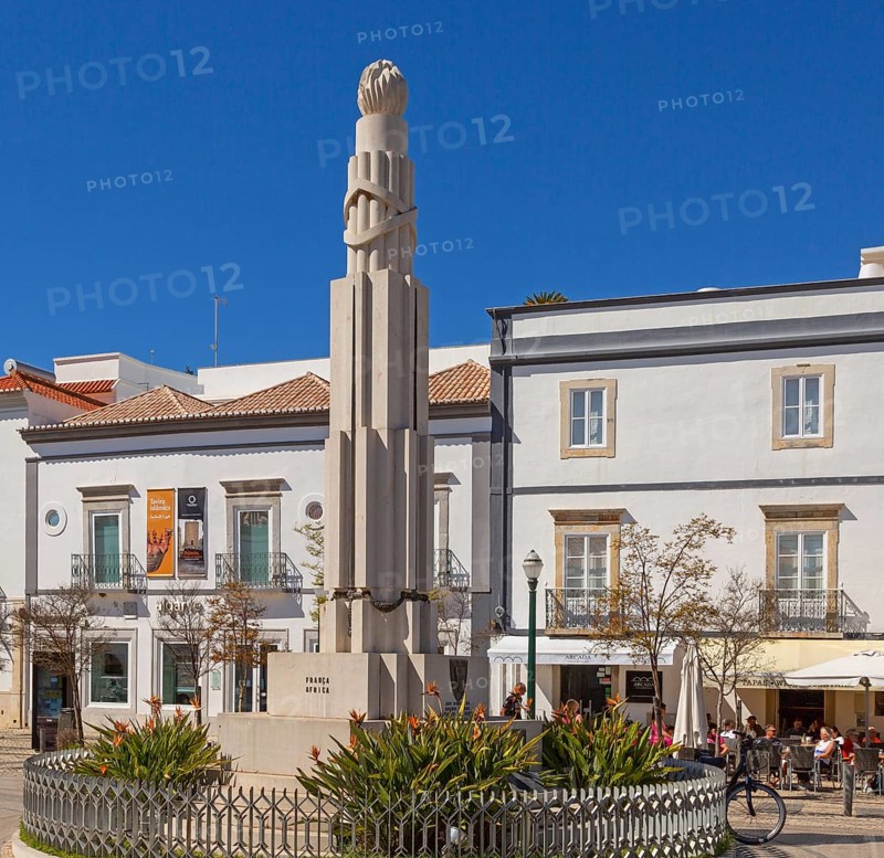 People sitting in sunshine outside street cafes in Praca da Republica, Tavira, Algarve, Portugal, Southern Europe, Europe