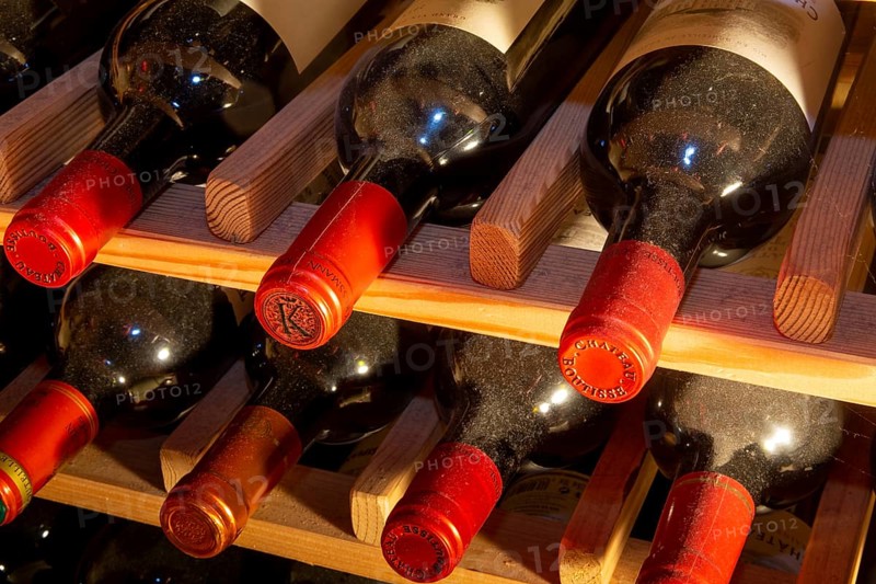 Wine cellar with red wine bottles (editorial)