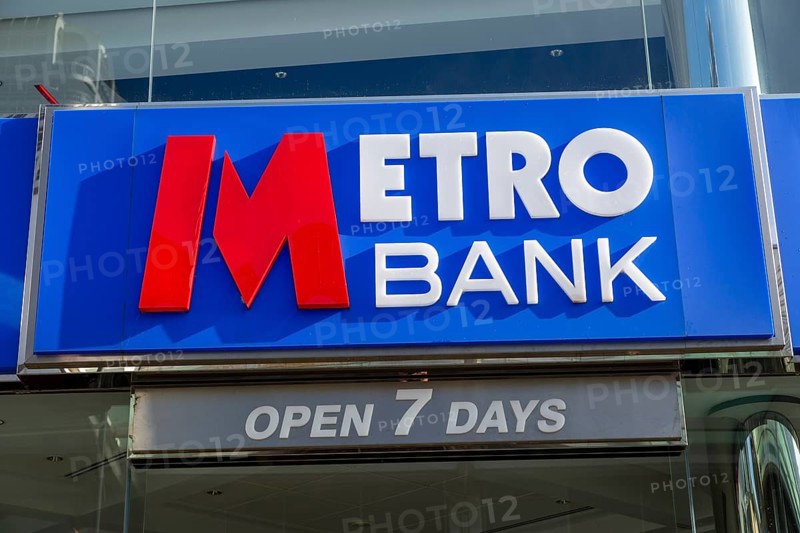 Signs on Metro Bank building, Regent Street, Swindon, Wiltshire, England, UK open 7 days