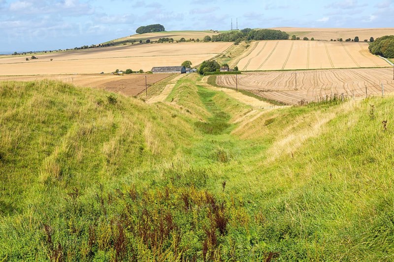 Ditch and earth bank rampart of Wansdyke view to Morgans Hill, near Devizes, Wiltshire, England, UK