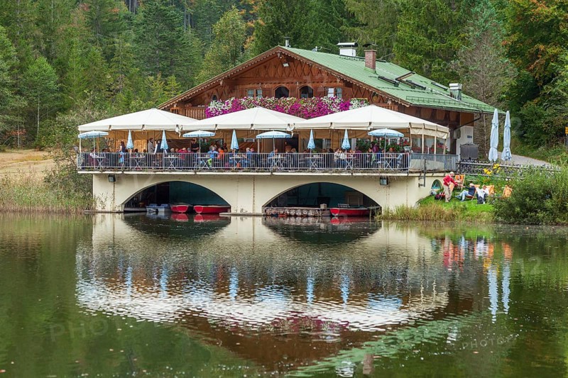 Pflegersee with inn under a cloudy sky, Garmisch-Partenkirchen, Werdenfelser Land, Upper Bavaria, Bavaria, Germany, Europe