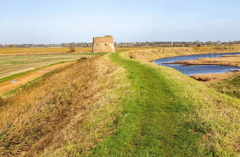 Martello tower Z from footpath on sea wall flood defence embankment, Alderton, Suffolk, England, UK