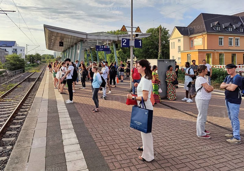 Many people waiting on the platform for the train, Luenen Central Station, North Rhine-Westphalia, Germany, Europe