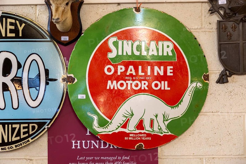 Vintage Sinclair Oplaine motor oil metal advertising sign on display at auction